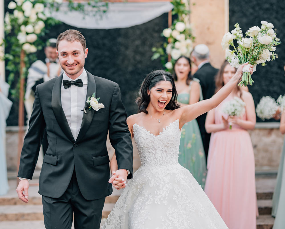 Bride-and-Groom-walking-down-the-aisle
